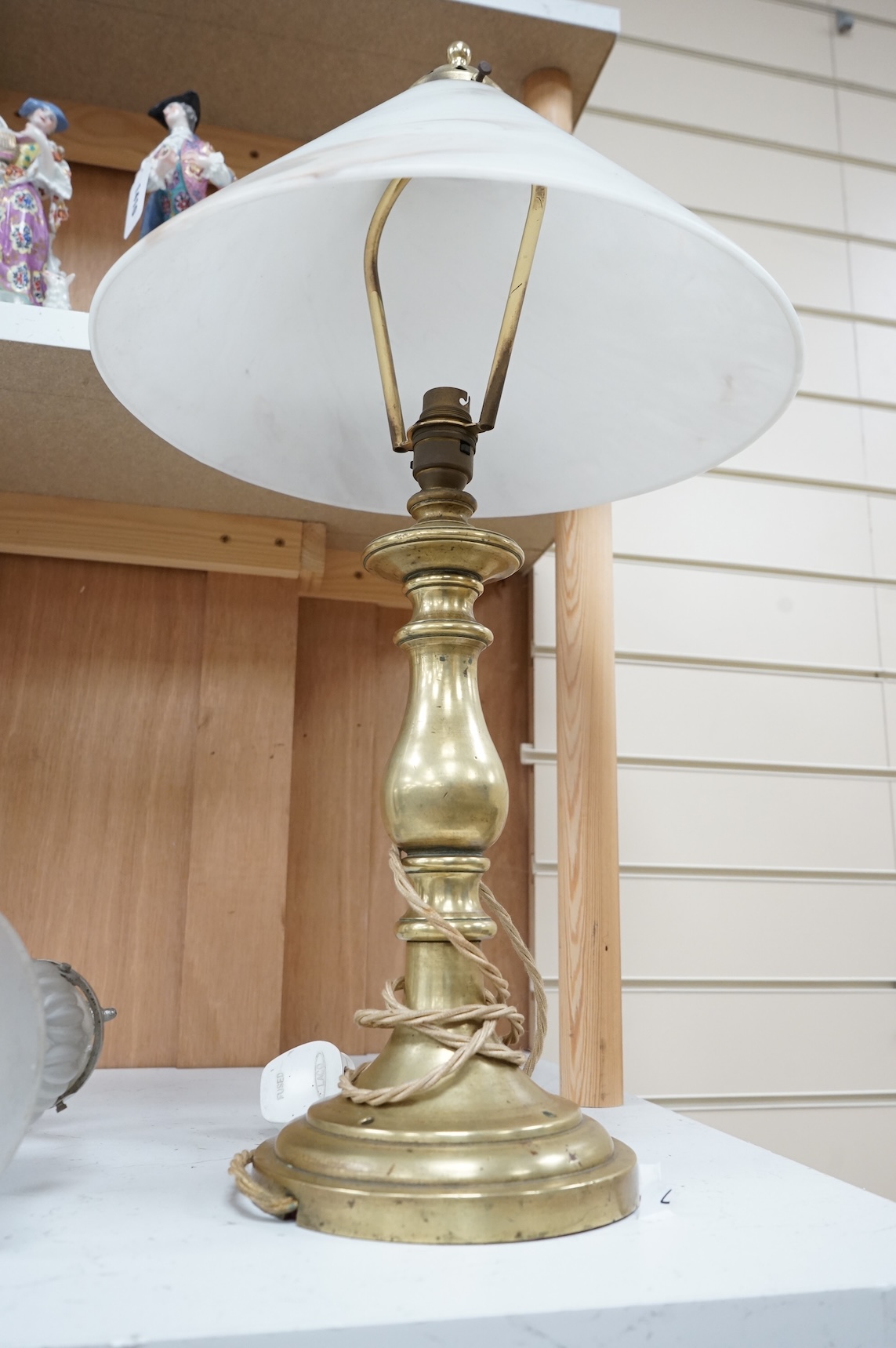 A brass table lamp and a chrome Art Deco style wall light, both with glass shades, lamp 58cm high